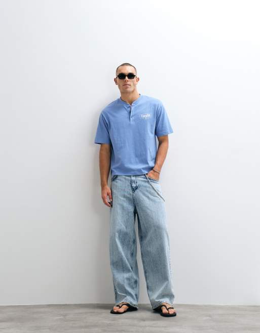 ASOS DESIGN heavyweight boxy relaxed polo with chest text graphic in blue wash, 2 of 5