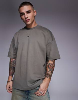 Футболка ASOS DESIGN heavyweight oversize с открытыми плечами цвета хаки 4990₽