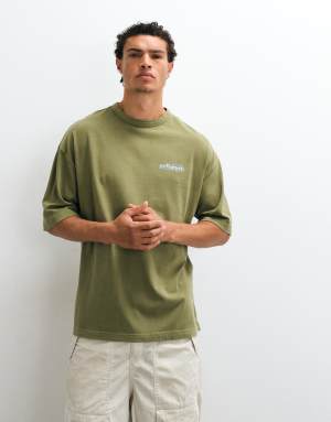 ASOS DESIGN heavyweight oversized t-shirt with chest text graphic in washed green