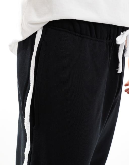 ASOS DESIGN heavyweight oversized trackies with side stripe 400gsm in black, 4 of 5