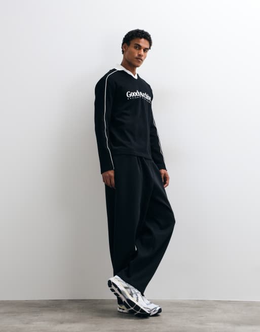 ASOS DESIGN heavyweight relaxed long sleeve polo with piping and text graphic in black waffle fabric, 2 of 5