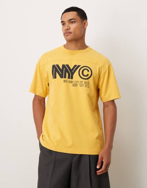 ASOS DESIGN heavyweight relaxed t-shirt with NYC graphic in washed yellow - view 1