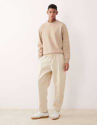 ASOS DESIGN heavyweight tapered fit sweatpants in beige scuba-style fabric