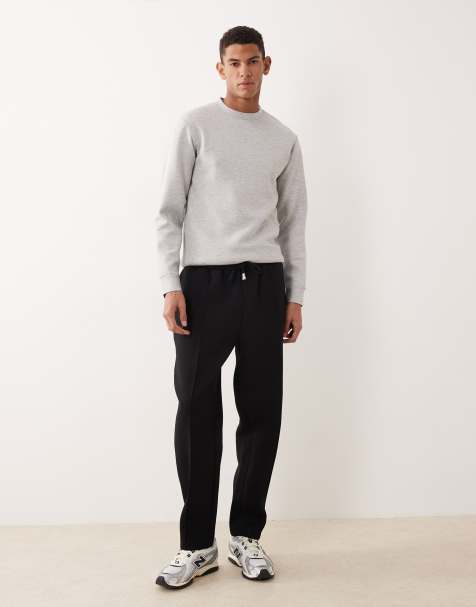 ASOS DESIGN heavyweight tapered fit trackies in scuba-style fabric in black - view 1