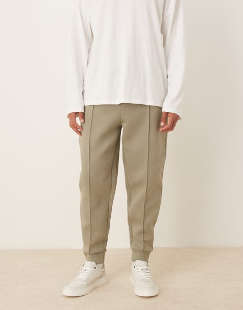 ASOS DESIGN heavyweight tapered joggers in scuba-style fabric with pin tucks in khaki - view 1