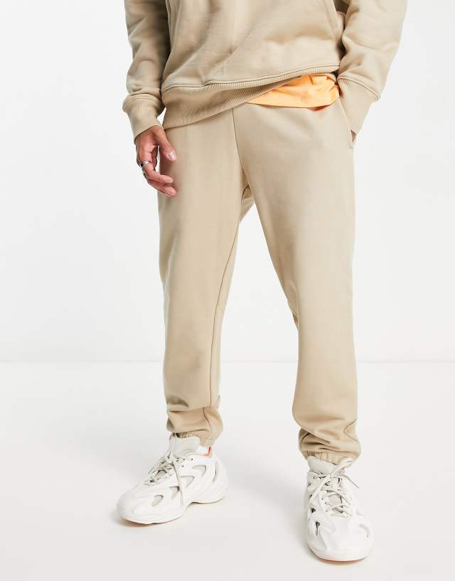 ASOS DESIGN heavyweight tapered sweatpants in beige