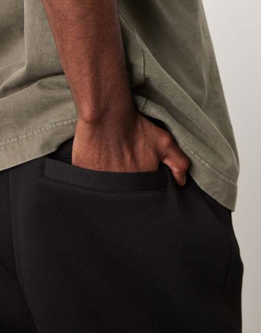 ASOS DESIGN heavyweight tapered sweatpants in scuba-style fabric in black, 2 of 5