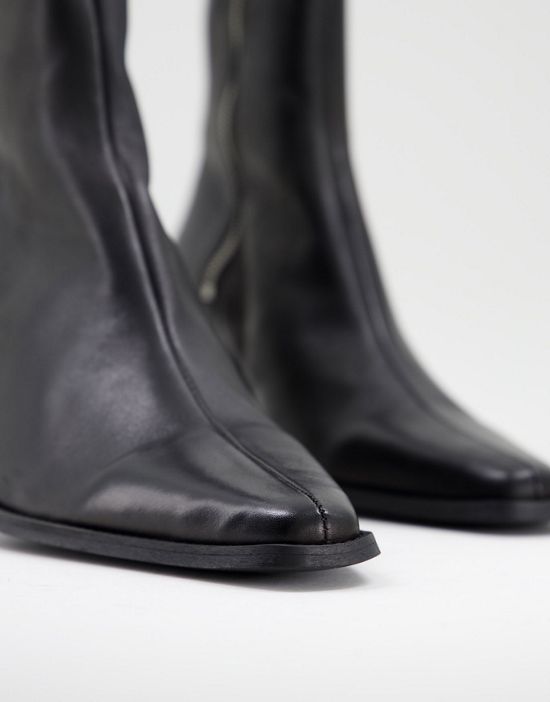 https://images.asos-media.com/products/asos-design-heeled-black-leather-chelsea-boot-with-angled-heel/200931798-2?$n_550w$&wid=550&fit=constrain