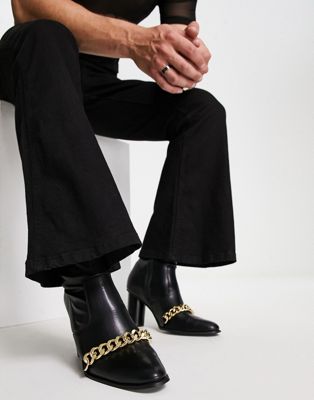 ASOS DESIGN heeled boots in black faux leather with gold chain detail
