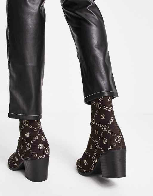ASOS DESIGN heeled chelsea boot in brown monogram knit with black sole ...