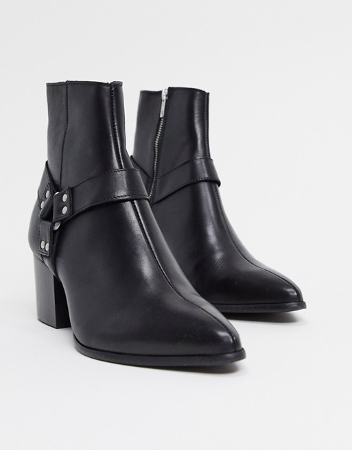 ASOS DESIGN heeled chelsea boots with pointed toe in black leather with strap detail