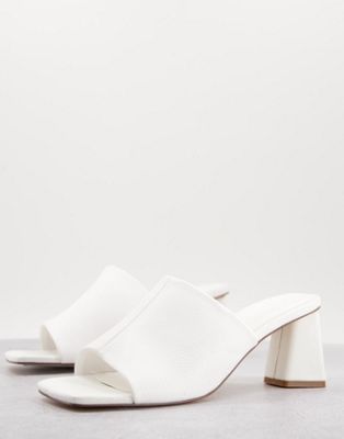 ASOS DESIGN heeled mules in white in faux leather