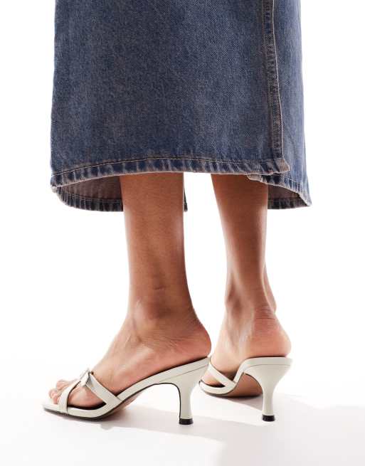 ASOS DESIGN Hendrix mini buckle detailed cross strap mid heeled mules in off-white, 2 of 4