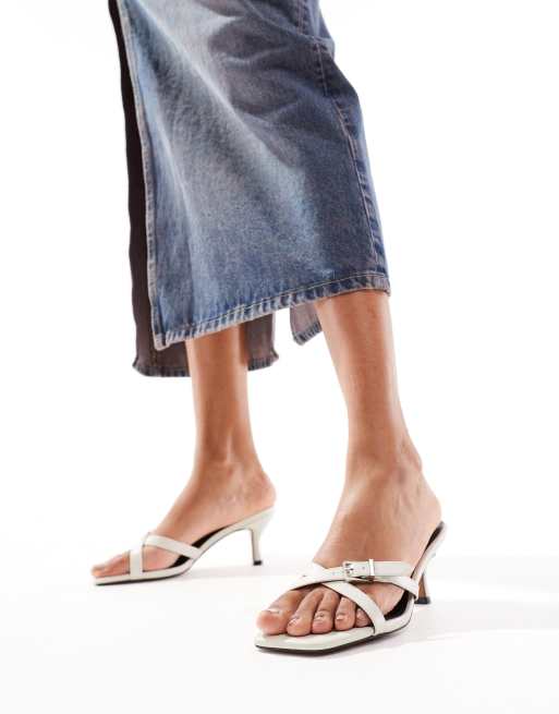 ASOS DESIGN Hendrix mini buckle detailed cross strap mid heeled mules in off-white, 4 of 4