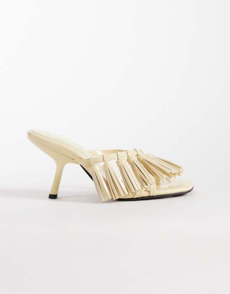 ASOS DESIGN – Hibernate – Mules in Buttermilchgelb mit mittelhohem Absatz und Quastendetail - view 1