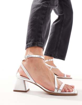 ASOS DESIGN Hibiscus asymmetric mid block heeled sandals in silver