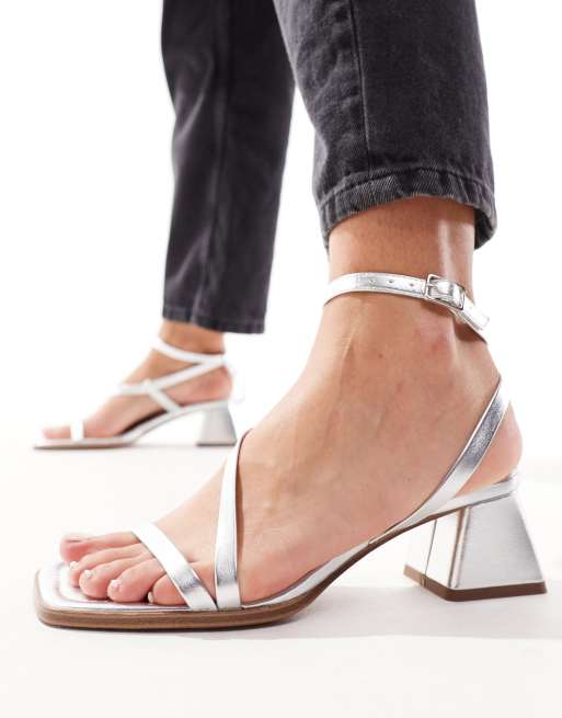 ASOS DESIGN Hibiscus asymmetric mid block heeled sandals in silver ASOS