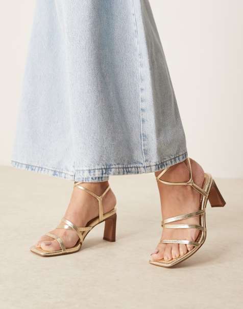 ASOS DESIGN – Hideaway – Guldfärgade sandaler med smala remmar, knytning runt benet och halvhöga blockklackar - view 1