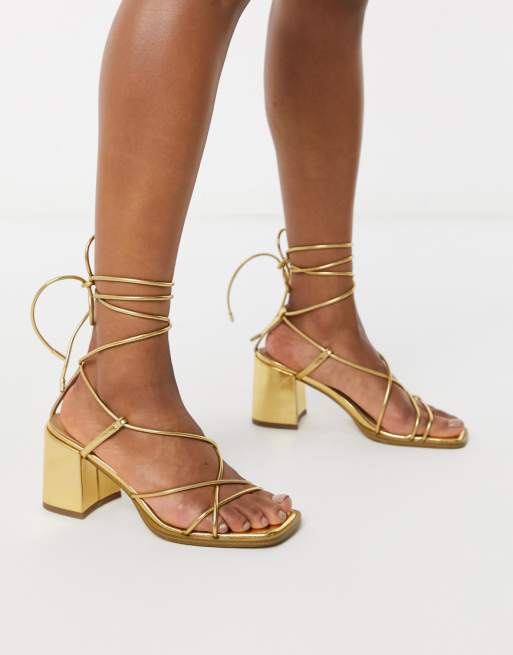ASOS DESIGN Hideout block heeled minimal strap sandals in gold | ASOS