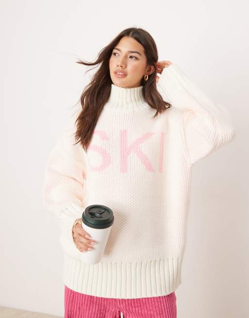 ASOS DESIGN high neck chunky jumper with ski slogan in cream