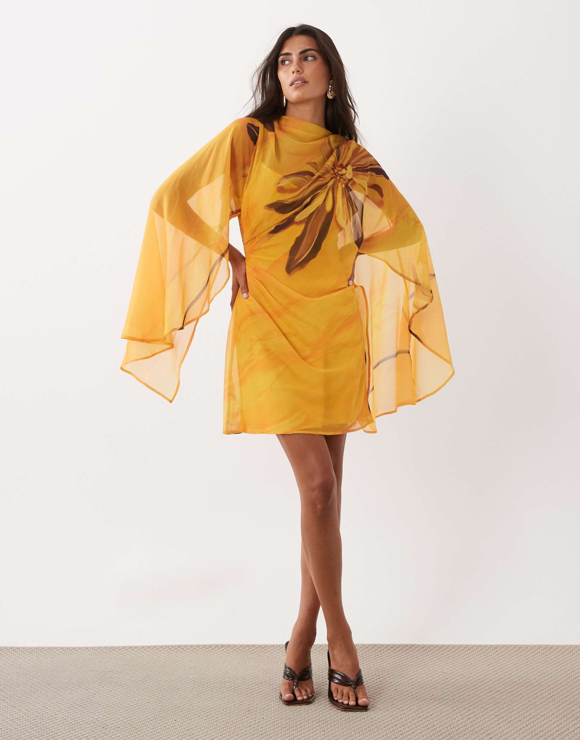 asos design high neck drape front extreme cape sleeve mini dress in yellow placement floral print