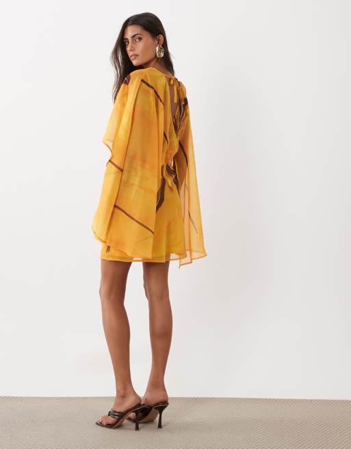 ASOS DESIGN high neck drape front extreme cape sleeve mini dress in yellow placement floral print, 3 of 4