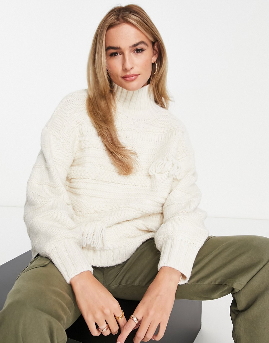 ASOS DESIGN high neck jumper in mixed texture with tassels in cream-White