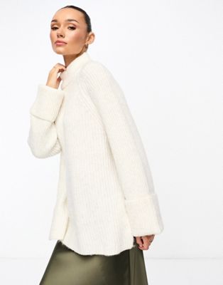 ASOS DESIGN high neck jumper with turn back cuff in long and lean block in cream