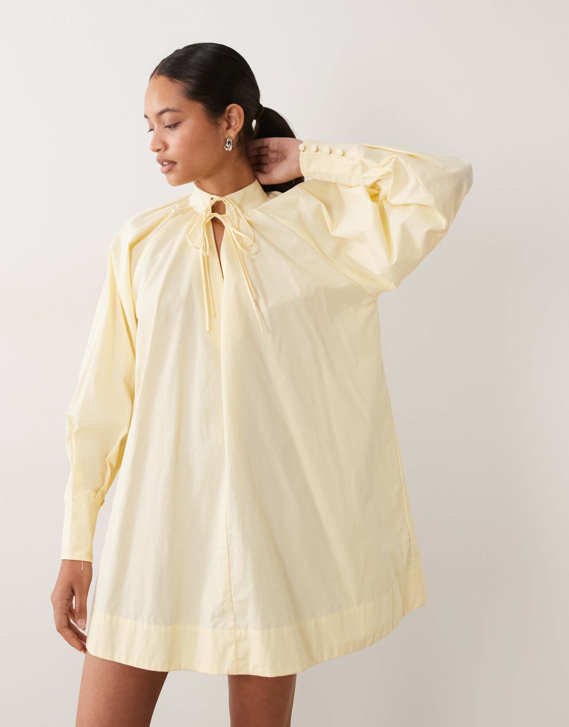 asos design high neck tie poplin mini dress with puff sleeve in tender yellow