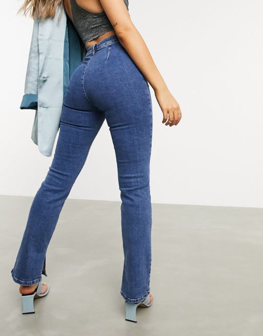 ASOS DESIGN high-rise 00s stretch flared jeans in mid-wash | ASOS