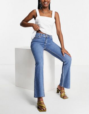 ASOS DESIGN high rise '70's' stretch flare jeans in midwash | ASOS