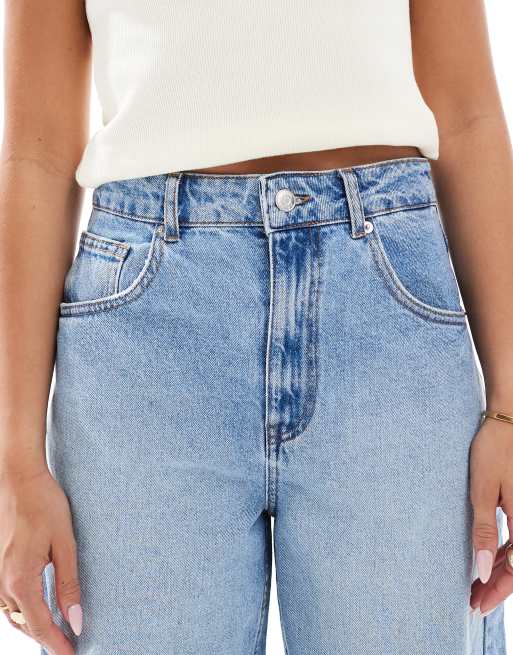 ASOS DESIGN high rise barrel jeans in mid blue with rips