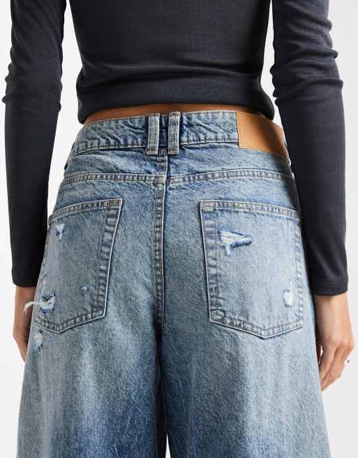 ASOS DESIGN high rise barrel leg jeans with rips in mid blue