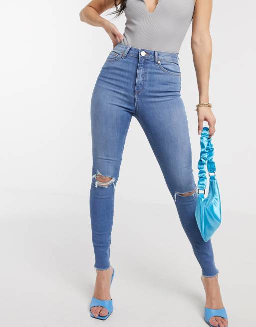 ASOS DESIGN high rise ridley skinny jeans in vintage lightwash blue with slash knee rips and raw hem