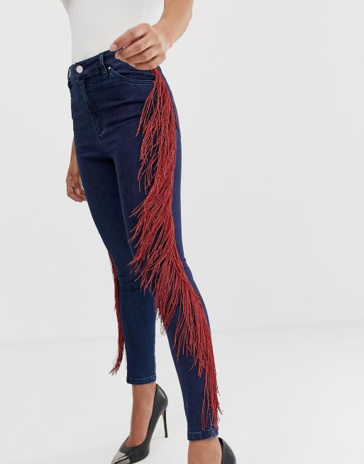 Jeans with fringe sales on side