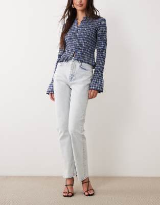 ASOS DESIGN high rise slim straight jeans in acid wash