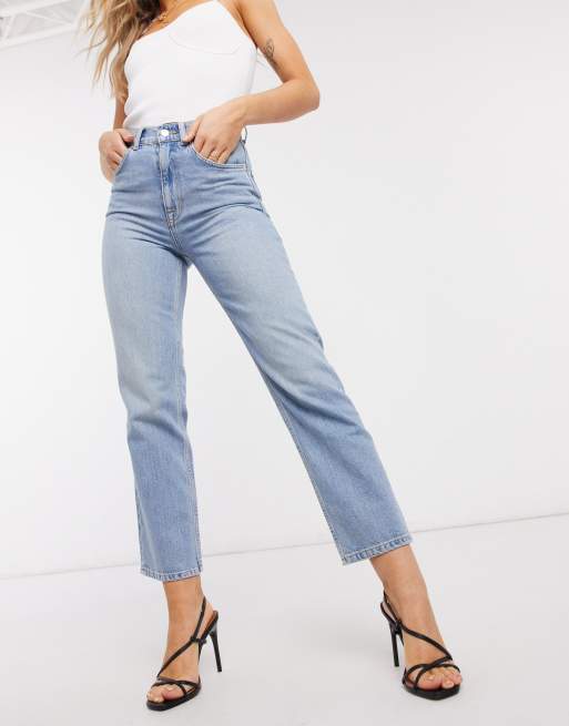 ASOS DESIGN mid rise comfort stretch straight leg jeans in midwash