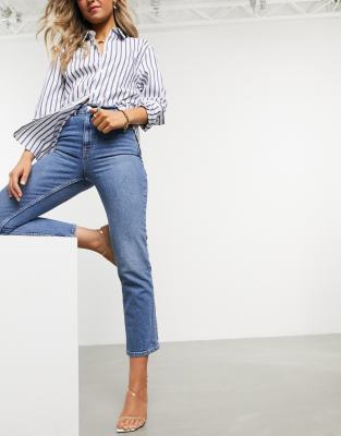 ASOS DESIGN mid rise comfort stretch straight leg jeans in midwash