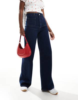 ASOS DESIGN high rise wide leg jeans with front pockets in rinse-Navy