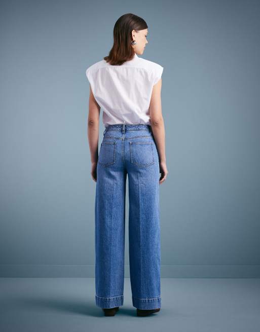 ASOS DESIGN high rise wide leg jeans with front pockets in mid blue