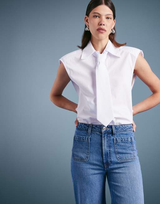 ASOS DESIGN high rise wide leg jeans with front pockets in mid blue