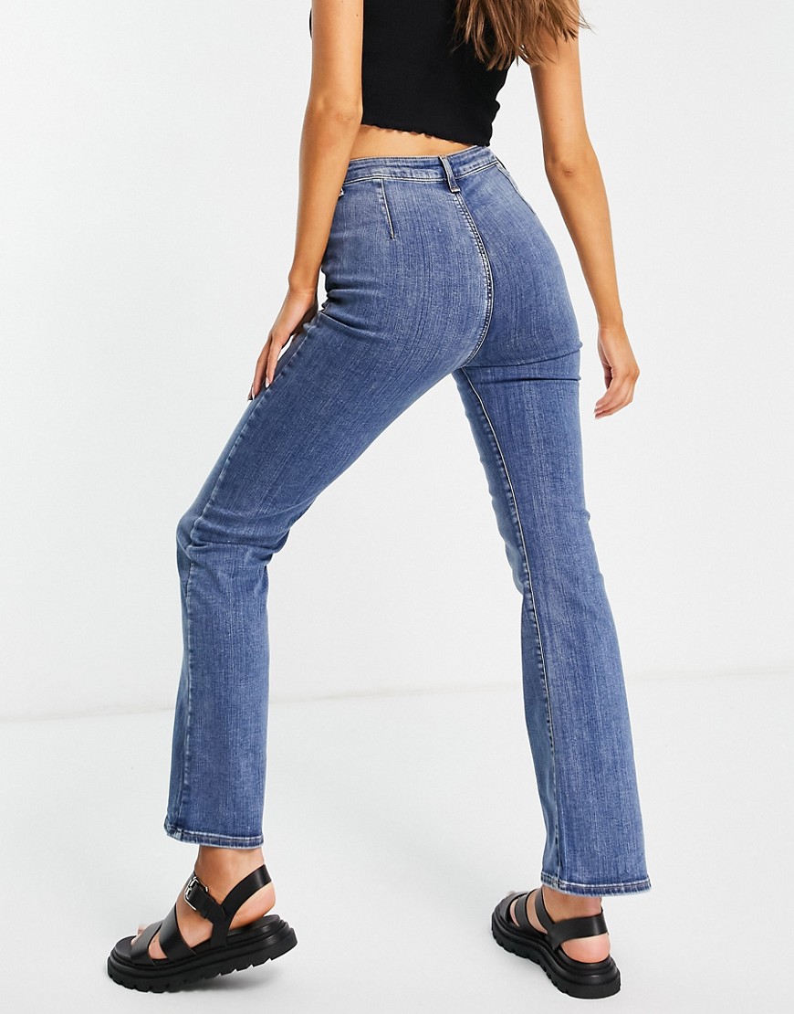 ASOS DESIGN high rise 'Y2K' stretch flare jeans in vintage midwash-Blues