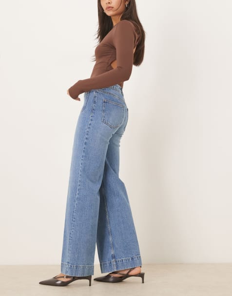 ASOS DESIGN high waist wide leg jeans with front pockets in midwash - view 1