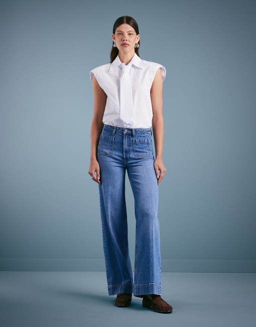 ASOS DESIGN high waist wide leg jeans with front pockets in mid blue