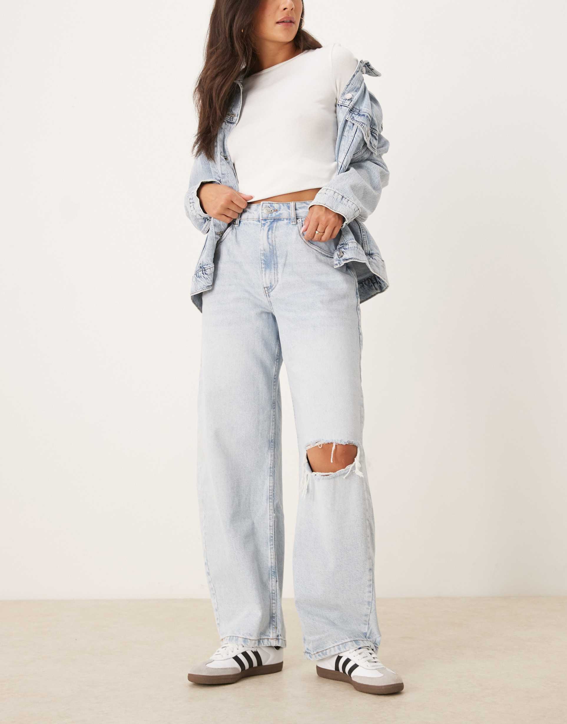 asos design high waisted barrel leg jeans in pale wash with rips