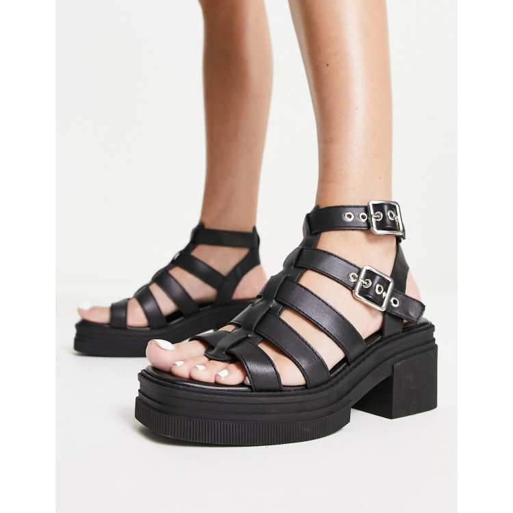 ASOS DESIGN Highway chunky mid heeled sandals in black