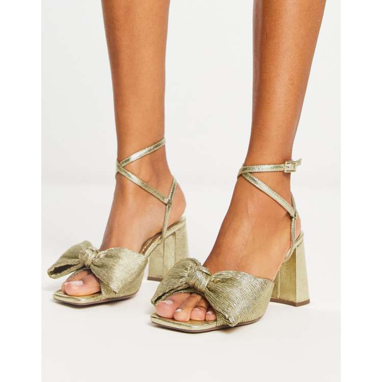 ASOS DESIGN Hitched bow detail mid block heeled sandals in gold