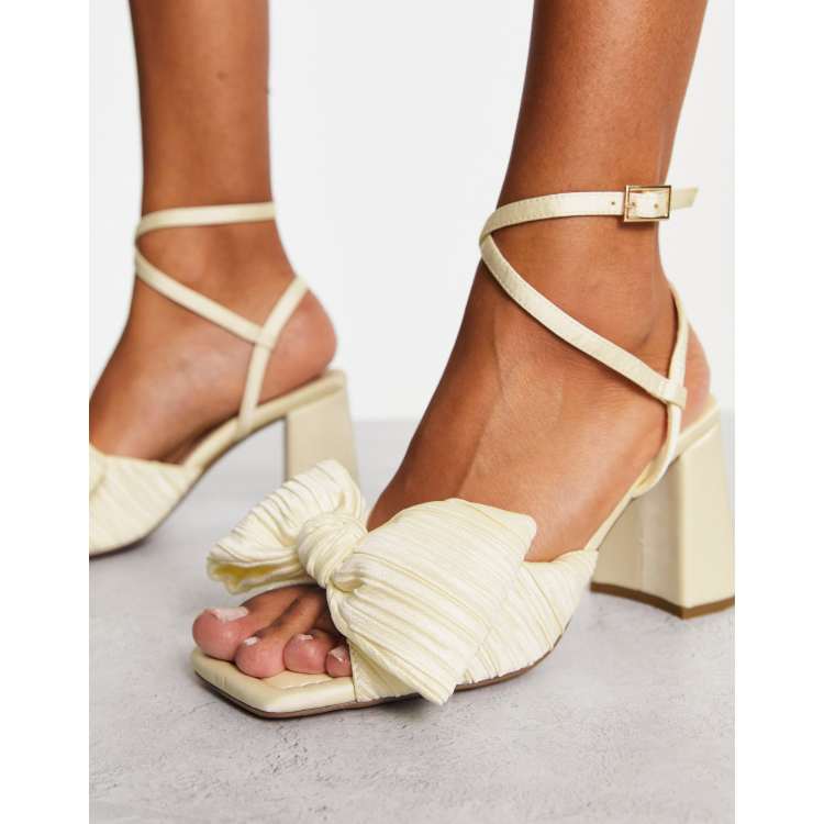 ASOS DESIGN Hitched bow detail mid block heeled sandals in ivory