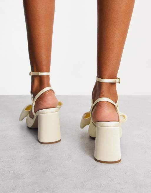 ASOS DESIGN Hitched bow detail mid block heeled sandals in ivory