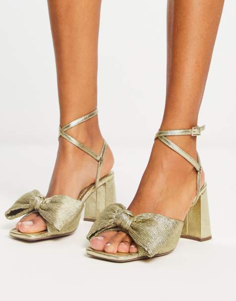 ASOS DESIGN – Hitched – Złote sandały na średnim obcasie klockowym z kokardą - view 1